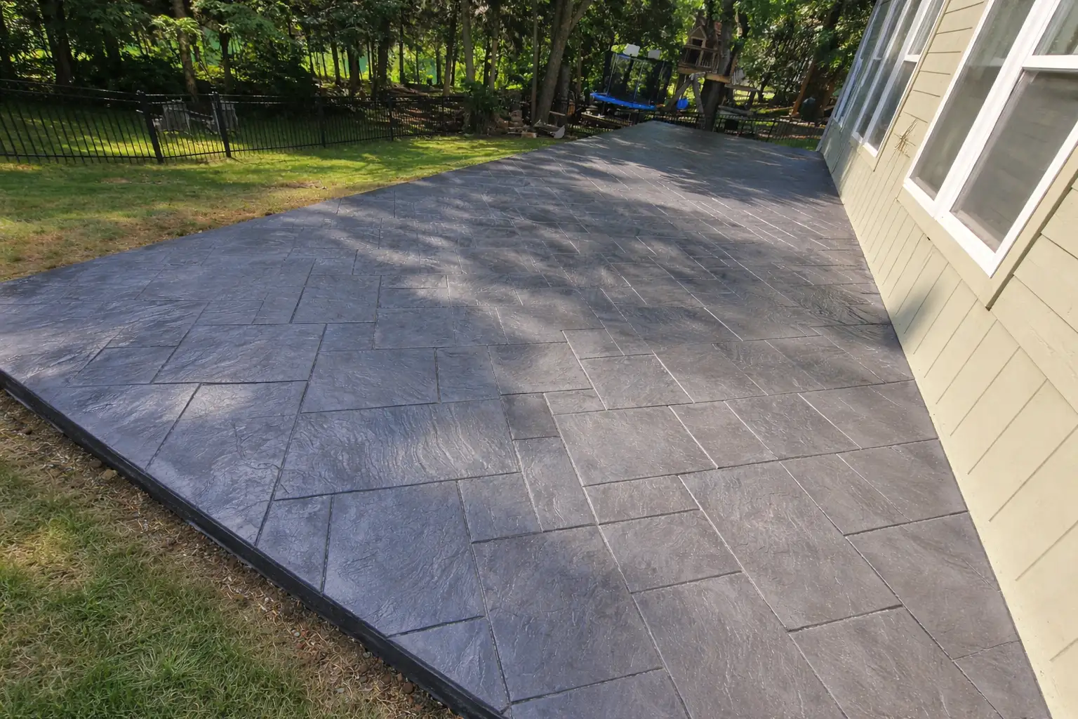 Ashlar slate stamped concrete patio installation in Kansas City